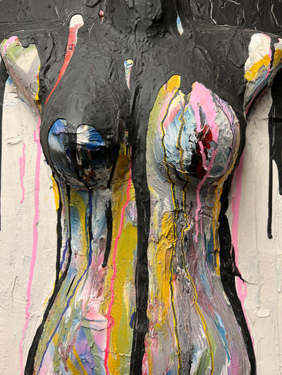 Painting of a naked womans body. The chest is sticking out of the canva
