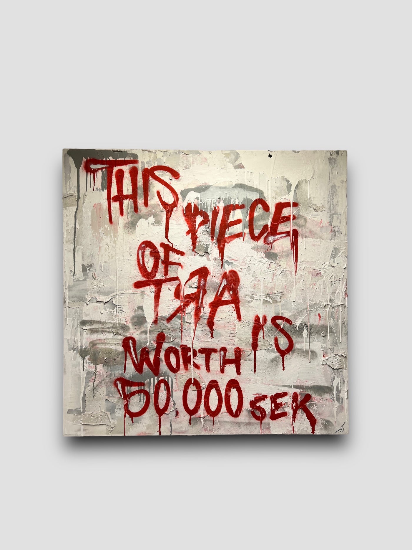 Canvas with red text that says "This piece of art is worth 50.000 Sek"