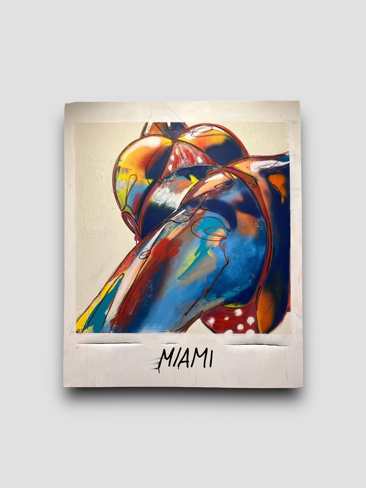 Painting of a girl with bikini and the text under the picture says "Miami"